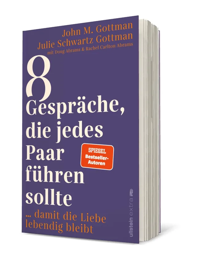 Cover von „8 Gespräche, die jedes Paar führen sollte“ von John M. Gottman und Julie Schwartz Gottman: Das Cover zeigt einen lila Hintergrund mit großen weißen und roten Schriftzügen, die den Titel und die Autoren hervorheben.