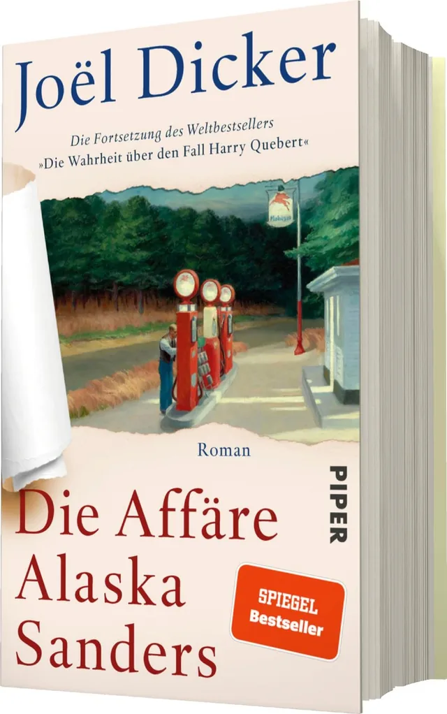 Das Buchcover zeigt eine malerische Landschaft mit einer benutzten Tankstelle im Vordergrund, umgeben von grünen Bäumen und einem blauen Himmel. In der oberen linken Ecke steht der Name des Autors, „Joël Dicker“, in einer eleganten Schrift. Darunter ist d