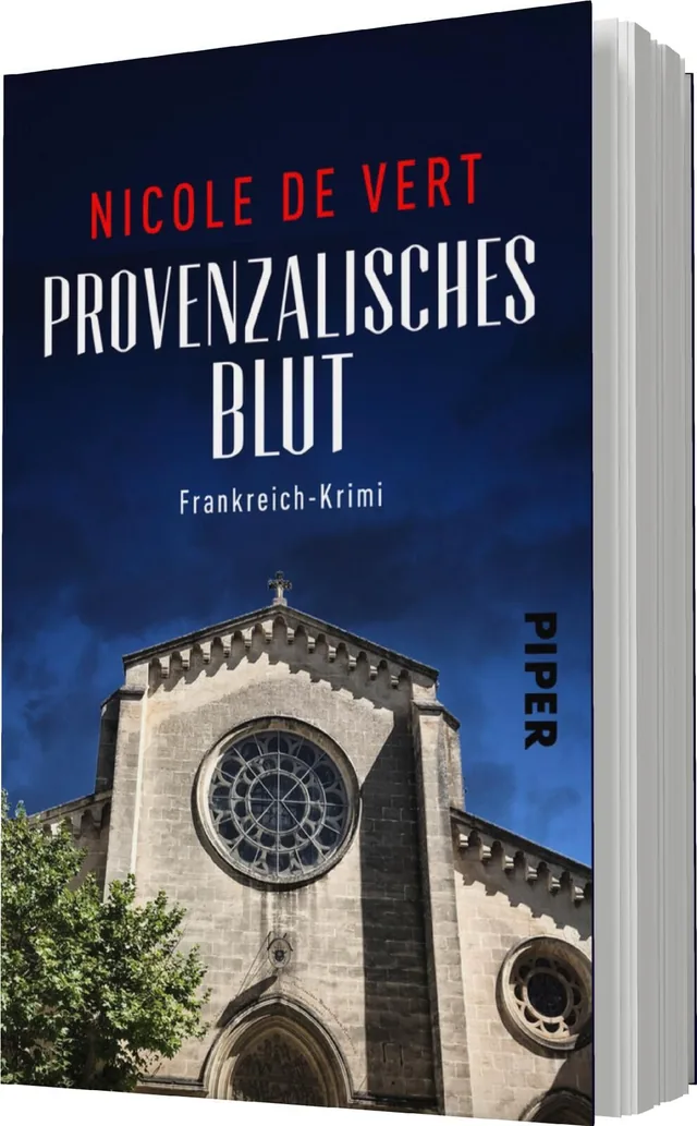 Das Buchcover zeigt eine dramatische Darstellung eines historischen Kirchengebäudes unter einem tiefblauen Himmel. Der Titel „Provenzalisches Blut“ ist in auffälligen, weißen Buchstaben geschrieben und wird von dem Namen der Autorin „Nicole de Vert“ in ro